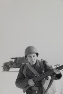 Military Soldier in Uniform Pointing Rifle Portrait, WWII, HQ 2nd Battalion, 389th Infantry, US Army Military Base, Indiana, USA, 1942