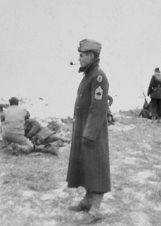 Military Soldier in Long Coat Smoking Pipe, Portrait, WWII, HQ 2nd Battalion, 389th Infantry, US Army Military Base, Indiana, USA, 1942