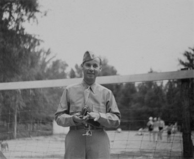 Soldier in Uniform in Front of Volleyball Net, Portrait, WWII, HQ 2nd Battalion, 389th Infantry, US Army Military Base, Indiana, USA, 1942