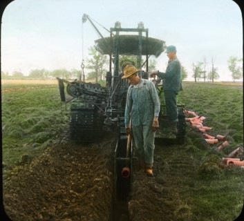Farmers Digging Ditch with Tractor and Laying Drain Tile, Wisconsin, USA, Magic Lantern Slide, circa 1915