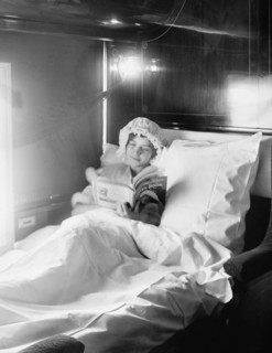 Woman Reading Book in Electric-Lighted Berth on Deluxe Overland Limited Train, USA, Detroit Publishing Company, 1915