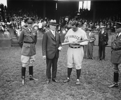 Secretary of War James W. Good Watching Babe Ruth of New York Yankees Signing First of Many Bats to be Awarded as Prizes at Citizens Military Camps Throughout U.S., Griffith Stadium, Washington DC, US...