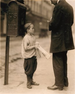 7-year-old Newsboy Selling Newspaper to Man, Works Every Day 2:30 to 8pm, 10am to Midnight on Saturday Earning 50 Cents per Day, Philadelphia, Pennsylvania, USA, Lewis Hine, 1910