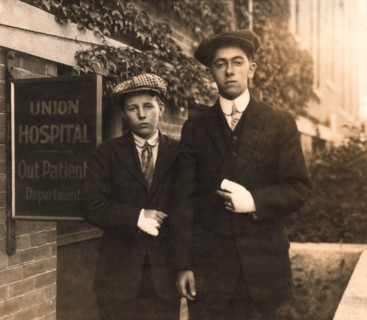 Portrait of Two 14-year-old Boys, Oscar Matoon and John Healy, with Hand Injuries Sustained while Working at Textile Mills, Fall River, Massachusetts, USA, Lewis Hine, 1916