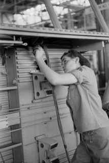 Female Worker Installing Electric Wiring in Fuselage, Vultee Aircraft Company, Nashville, Tennessee, USA, Jack Delano for Office of War Information, August 1942