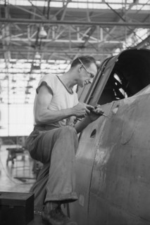 Worker Riveting a Fuselage on a Sub-Assembly Line, Vultee Aircraft Company, Nashville, Tennessee, USA, Jack Delano for Office of War Information, August 1942