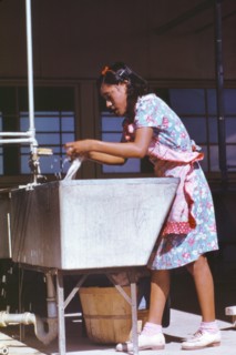 Young Woman at Community Laundry, Farm Security Administration (FSA) Camp, Robstown, Texas, USA, Arthur Rothstein for Farm Security Administration, January 1942