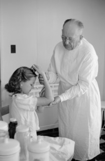 Doctor Examines Young Girl's Fractured Arm, Farm Security Administration (FSA) Camp Clinic, Weslaco, Texas, USA, Arthur Rothstein for Farm Security Administration, February 1942