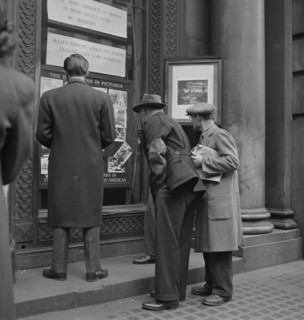 Men Reading News Bulletins and Looking at News Pictures outside Baltimore News Building, Baltimore, Maryland, USA, Marjorie Collins for Office of War Information, April 1943