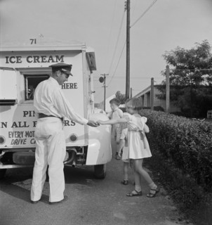 Young Girl Buying Ice Cream from Good Humor Man at Federal Housing Project, Greenbelt, Maryland, USA, Marjorie Collins for Farm Security Administration, June 1942