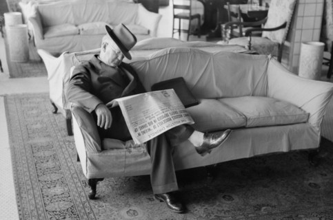Man Falling Asleep while Reading Newspaper in Hotel Lobby, Taylor, Texas, Russell Lee, November 1939