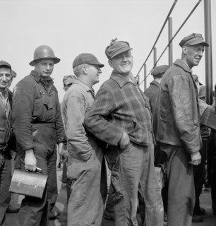 Workers Lining up Before Time Clock, Bethlehem-Fairfield, Shipyards, Baltimore, Maryland, USA, Arthur S. Siegel for Office of War Information, May 1943