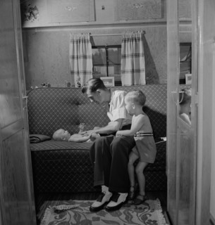Father with Two Children in Trailer Home at Glenn L. Martin Trailer Village, a Farm Security Administration (FSA) Housing Project, Middle River, Maryland, USA, John Collier for Office of War Informati...