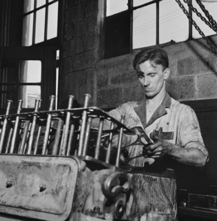 Mechanic Working on Greyhound Bus Engine at Garage, Pittsburg, Pennsylvania, USA, Esther Bubley for Office of War Information, September 1943