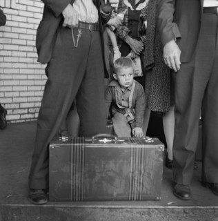 Young Boy with Group of People Waiting for Greyhound Bus during Trip from Louisville, Kentucky to Memphis, Tennessee, USA, Esther Bubley for Office of War Information, September 1943