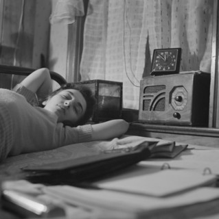 Young Woman Sleeping While Listening to Radio in Boardinghouse Room, Washington DC, USA, Esther Bubley for Office of War Information, January 1943