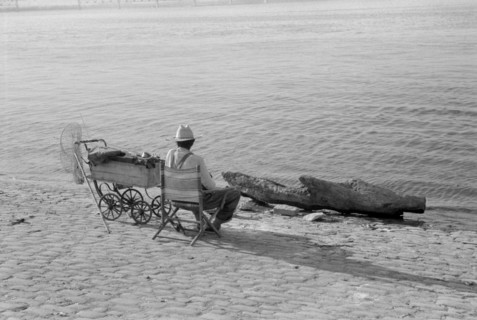 Man Fishing Along Ohio River, Louisville, Kentucky, USA, Marion Post Wolcott for Farm Security Administration, July 1940