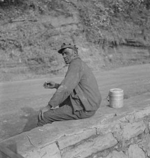 Coal Miner Smoking Cigarette while Waiting for Ride Home after Work, Capels, West Virginia, USA, Marion Post Wolcott for Farm Security Administration, September 1938