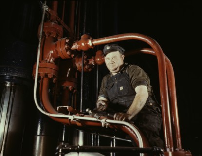 Maintenance Mechanic in Largest Coal Press in World, Combustion Engineering Company, Chattanooga, Tennessee, USA, Alfred T. Palmer for Office of War Information, June 1942