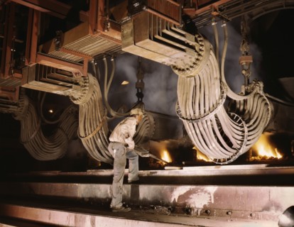 Worker at Large Electric Phosphate Smelting Furnace used in Making of Elemental Phosphorus in TVA Chemical Plant, near Muscle Shoals, Alabama, USA, Alfred T. Palmer for Office of War Information, June...