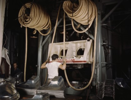 Factory Worker Assisting Huge Drop Hammer with Hemp Rope to Manufacture Sheet Metal Parts for United Nations Bombers and Fighter Planes, North American Aviation, Inc, Inglewood, California, USA, Alfre...