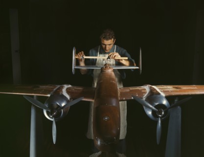 Worker Preparing Experimental Scale Model of B-25 Airplane for Wind Tunnel Tests, North American Aviation Plant, Inglewood, California, USA, Alfred T. Palmer for Office of War Information, October 194...