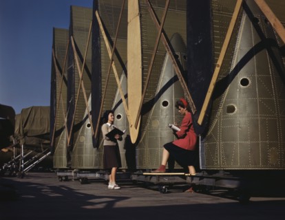 Female Inspectors Making Notes while Checking Cargo Transport Inner wings before Assembly on Fuselage, Douglas Aircraft Company, Long Beach, California, USA, Alfred T. Palmer for Office of War Informa...