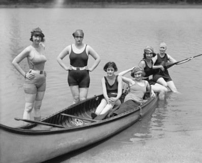 Actress Kay Laurel (seated with hat) and Group of Women in Bathing Suits Posing with Canoe at Bathing Beach, Washington DC, USA, National Photo Company, July 1922