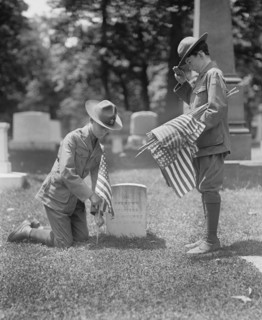 Two Boy Scouts putting American Flags at Grave of 14 Unknown Soldiers and Sailors from War of 1812, Arlington National Cemetery, Arlington, Virginia, USA, National Photo Company, May 1925