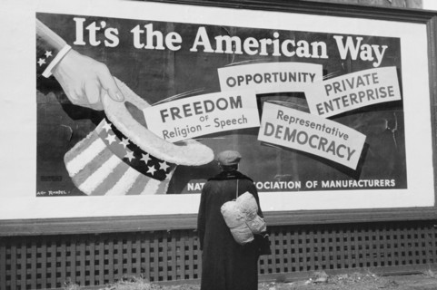 Man Standing in front of National Association of Managers Billboard, Dubuque, Iowa, USA, John Vachon for Farm Security Administration, April 1940