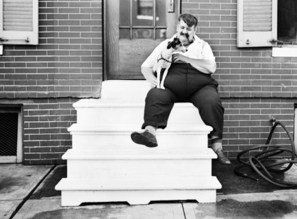 Heavy Man with Dog in front of Row House, Baltimore, Maryland, USA, John Vachon for Office of War Information, July 1938