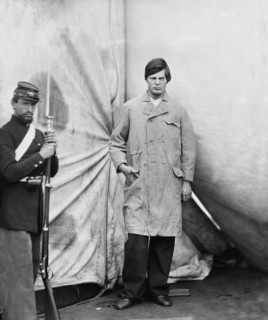 Lewis Powell, also known as Lewis Payne, Attacker of U.S. Secretary of State William H. Seward, and Conspirator in Assassination of U.S. President Abraham Lincoln, Standing in Overcoat, Washington Nav...