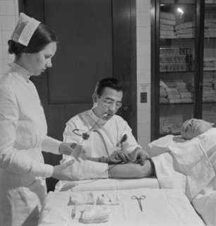 Nurse Assisting Doctor with Blood Transfusion, Fritz Henle for Office of War Information, November 1942