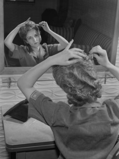 Female Worker Styling her Short Hair for Safe Industrial Work during World War II, Bendix Aviation Plant, Brooklyn, New York, USA, Ann Rosener for Office of War Information, March 1943