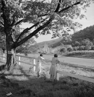 Two Women Viewing Amusement Park from Across Field, Southington, Connecticut, USA, Fenno Jacobs for Office of War Information, May 1942
