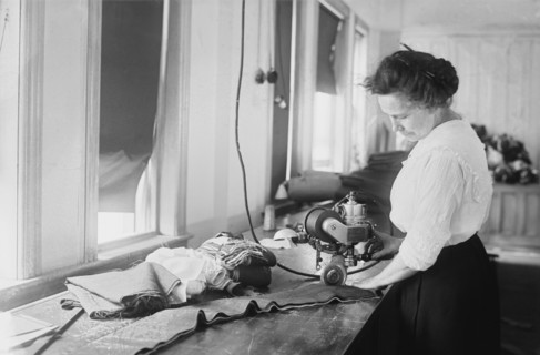 Woman Cutting Flag Stripes for American Flags, Brooklyn Navy Yard, Brooklyn, New York, USA, Bain News Service, July 1917