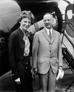 Amelia Earhart (L), Portrait with Man in front of Airplane, Harris & Ewing, 1932