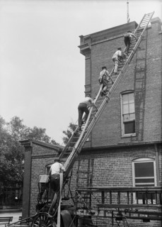Firemen Climbing Ladder onto Building, Firemen's School, Washington DC, USA, Harris & Ewing, 1921