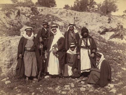 Bedouin Men of Arakat Tribe, Portrait in Rocky Landscape with Swords and Rifles, American Colony Photo Department, early 1900's
