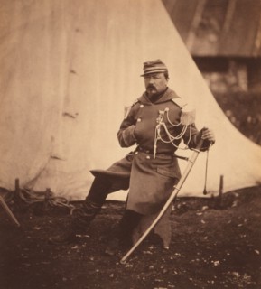 French Provost Marshal of the Division of General Bosquet, Full-Length Seated Portrait Wearing Uniform with One Hand Placed inside his Coat, Crimean War, Crimea, Ukraine, by Roger Fenton, 1855