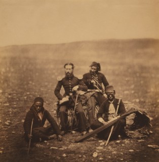 Mr. Justus Thompson, of the Commissariat, Full-Length Portrait, Sitting on a Gabion, Surrounded by Attendants of Ismail Pacha, Crimean War, Crimea, Ukraine, by Roger Fenton, 1855