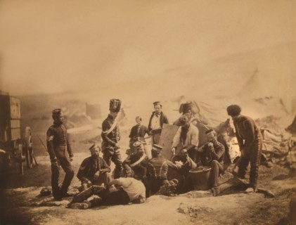British Soldiers of the 8th Hussars Standing and Sitting around Cooking Pots as Cook Ladles Food into Bowl, Crimean War, Crimea, Ukraine, by Roger Fenton, 1855
