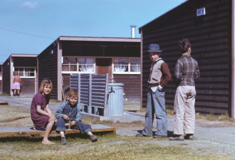 Boy Building Model Airplane while other Children Look on, Farm Security Administration (FSA) Labor Camp, Robstown, Texas, USA, Arthur Rothstein for Farm Security Administration - Office of War Informa...