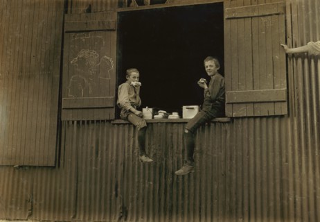 Two Young Boys eating Lunch, Economy Glass Works, Morgantown, West Virginia, USA, Lewis Hine for National Child Labor Committee, October 1908