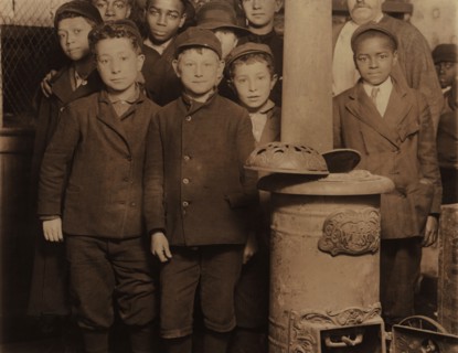 Group of Young Newsboys at 5:00 a.m. on Sunday Getting Ready to Sell Newspapers from McIntyre's Branch, Chestnut and 16th Streets, St. Louis, Missouri, USA, Lewis Hine for National Child Labor Committ...