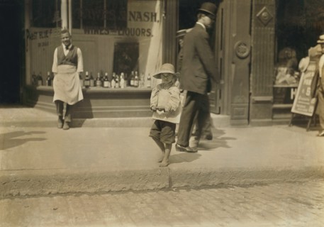 Willie Hutchinson, 6-yearl-old Newsie, Full-Length Portrait on Sidewalk, Richmond, Virginia, USA, Lewis Hine for National Child Labor Committee, June 1911
