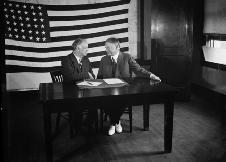 Charles Curtis & Herbert Hoover sitting at Table, American Flag Hanging in Background, Harris & Ewing, 1928