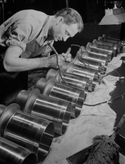 Worker Inspecting and Etching Cylinder Barrels for Airplane Engines at Manufacturing Plant, Pratt & Whitney, East Hartford, Connecticut, USA, Andreas Feininger for Office of War Information, June 1942