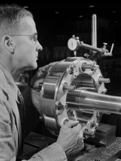 Worker Carefully Checking an Airplane Propeller Shaft for Concentricity at Manufacturing Plant, Pratt & Whitney, East Hartford, Connecticut, USA, Andreas Feininger for Office of War Information, June ...