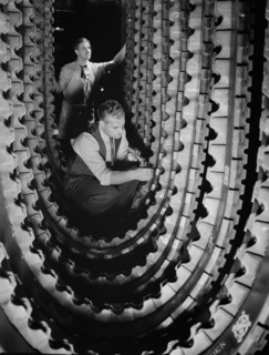 Two Workers Inspecting Tracks for Army's Half-Track Scout Cars, BF Goodrich, Akron, Ohio, USA, Alfred T. Palmer for Office of War Information, December 1941